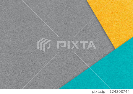 Texture of craft gray color paper background with yellow and turquoise border. Vintage abstract grey cardboard. 124208744