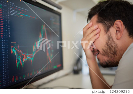 Focused business man trader analyst looking at computer monitor, investor broker analyzing indexes Focused business man trader analyst looking at computer monitor, investor broker analyzing indexes 124209256