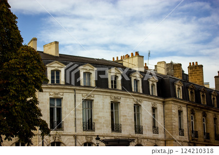 Facade of old mansion, apartment house on city old street. Element of the house. French style of architecture. Typical Paris houses roofs. Travel pic 124210318