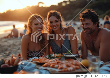 Beach picnic with friends coastal sunset food gathering relaxed atmosphere joyful moments 124211135