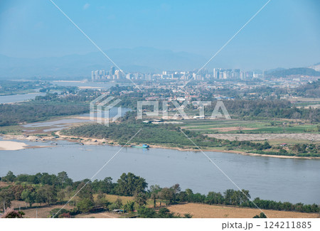 Scenery view of Ton Pheung district on the banks of Mekong River in Bokeo Province, Laos. View seen from Chiang Saen district. Scenery view of Ton Pheung district on the banks of Mekong River in Bokeo Province, Laos. View seen from Chiang Saen district. 124211885