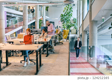In a modern startup office, a diverse group of young professionals collaboratively tackles various business problems and challenges, surrounded by their engaged colleagues, fostering innovation and 124212165