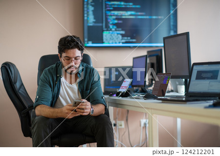 A programmer diligently testing smartphone applications  124212201