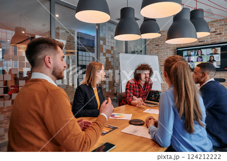 In the vibrant ambiance of a modern startup office, a diverse team of business professionals engage in discussions on various projects and develop new business strategies, epitomizing creativity and In the vibrant ambiance of a modern startup office, a diverse team of business professionals engage in discussions on various projects and develop new business strategies, epitomizing creativity and 124212222