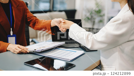 Business partnership handshake concept.Photo two coworkers handshaking process.Successful deal after great meeting. 124212899