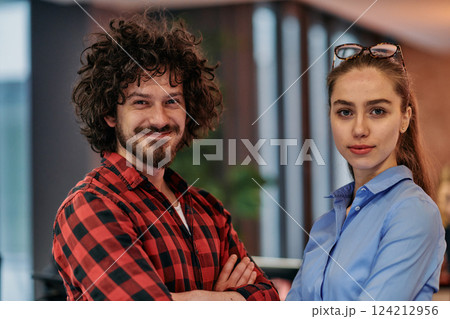 Corporate Collaboration: European Blonde Businesswoman and Colleague Standing in Modern Office 124212956