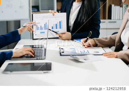 Business team meeting present.professional investor working with  Finance managers task. with laptop smart phone and digital tablet 124212958