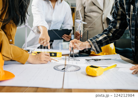 Creative architect projecting on the big drawings with architectural project Creative architect projecting on the big drawings with architectural project 124212984