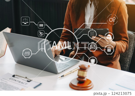 AML Anti Money Laundering Financial Bank Business Concept. judge in a courtroom using laptop and tablet with AML anti money laundering icon 124213075