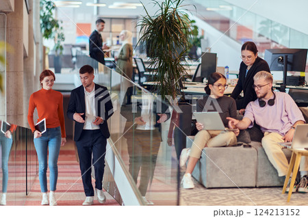 In a modern startup office, a diverse group of young professionals collaboratively tackles various business problems and challenges, surrounded by their engaged colleagues, fostering innovation and 124213152