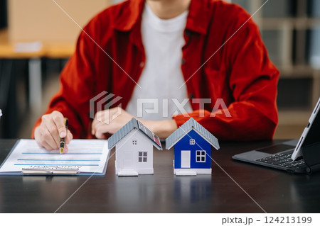 Signing a contract. Client and broker agent, lease agreement, successful deal and  Young business sitting 124213199