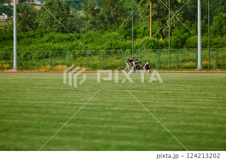A cameraman filming the participants of the Paralympic race on the marathon course A cameraman filming the participants of the Paralympic race on the marathon course 124213202