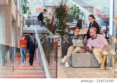 In a modern startup office, a diverse group of young professionals collaboratively tackles various business problems and challenges, surrounded by their engaged colleagues, fostering innovation and 124213295
