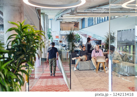 In a modern startup office, a diverse group of young professionals collaboratively tackles various business problems and challenges, surrounded by their engaged colleagues, fostering innovation and 124213418