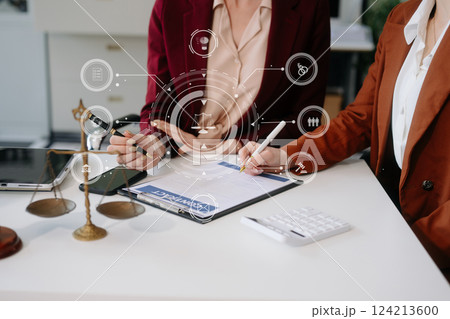 Business and lawyers discussing contract papers with brass scale on desk in office. Law, legal services, advice, 124213600