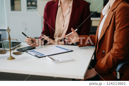 Business and lawyers discussing contract papers with brass scale on desk in office. Law, legal services, advice, 124213601