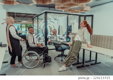 Young group of business people brainstorming together in a startup space, discussing business projects, investments, and solving challenges. 124213725