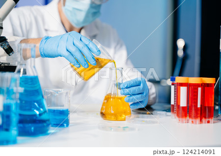 Scientists, beakers, and microscopes in cutting-edge research. Perfect for science and technology projects. Scientists, beakers, and microscopes in cutting-edge research. Perfect for science and technology projects. 124214091