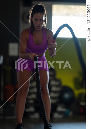 Fit Woman Performing Rope Conditioning Exercise in the Gym Fit Woman Performing Rope Conditioning Exercise in the Gym 124215066