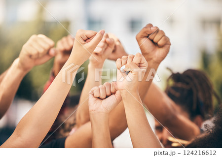 Hands, protest and community with a group of people fighting for change or human rights in the city. Freedom, collaboration and politics with a crowd standing for climate change or equality outdoor 124216612