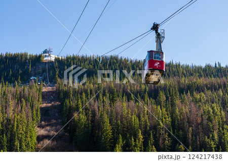Jasper, Alberta, Canada - May 21 2021 : Jasper SkyTram aerial tramway ascending the snow-capped Rocky Mountains. Jasper, Alberta, Canada - May 21 2021 : Jasper SkyTram aerial tramway ascending the snow-capped Rocky Mountains. 124217438