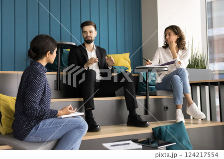 Briefing participants listening team leader explain project details Briefing participants listening team leader explain project details 124217554