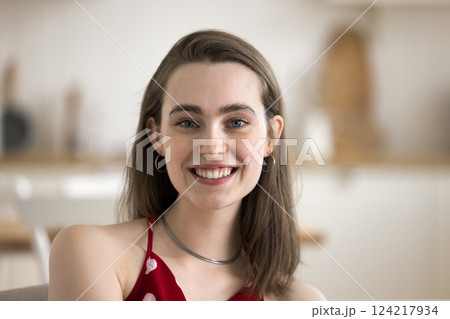 Head shot portrait attractive young female with white smile 124217934