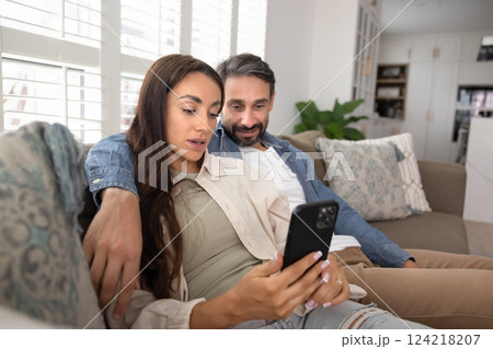 Couple using web service, app on smartphone for Internet communication 124218207