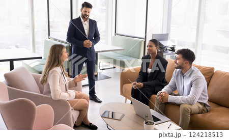 Four teammates met in coworking space to solve business-related matters Four teammates met in coworking space to solve business-related matters 124218513