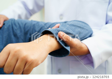 Physical therapy, Asian therapist doctor treat perform pain therapy in hospital. Physical therapy, Asian therapist doctor treat perform pain therapy in hospital. 124218703