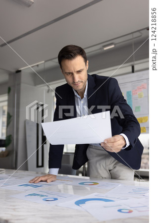 Pensive Hispanic business leader man thinking on financial investment strategy Pensive Hispanic business leader man thinking on financial investment strategy 124218856