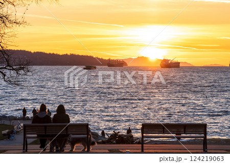 Vancouver residents enjoy the sunset time at English Bay Beach, Vancouver City beautiful landscape ans lifestyle. British Columbia, Canada. 124219063