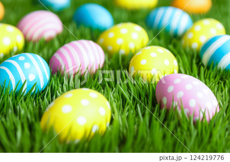 Vibrant Easter Eggs Scatter On Lush Green Grass Playful Spring Scene Of Pink, Yellow Blue Delights In Fresh Field With Depth, Creating Cheerful Celebration Vibrant Easter Eggs Scatter On Lush Green Grass Playful Spring Scene Of Pink, Yellow Blue Delights In Fresh Field With Depth, Creating Cheerful Celebration 124219776