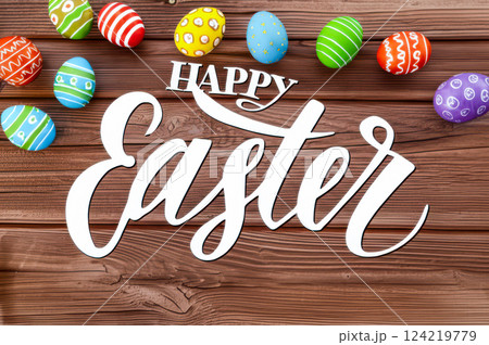Happy Easter Festive White Font Colorful Easter Eggs On Rustic Brown Wood Unique Bright Holiday Theme With Decorated Eggs Cheerful Celebration 124219779