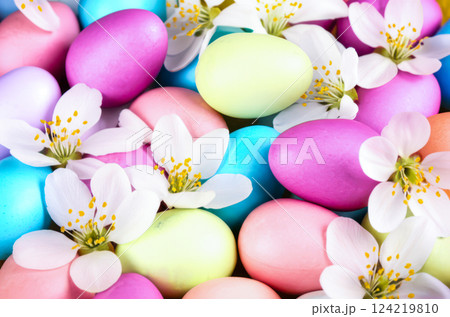 Closeup Easter Arrangement Vibrant Yellow Pink Eggs With Delicate White Springtime Blossoms, Fresh Festive Display For Easter Celebrations Closeup Easter Arrangement Vibrant Yellow Pink Eggs With Delicate White Springtime Blossoms, Fresh Festive Display For Easter Celebrations 124219810