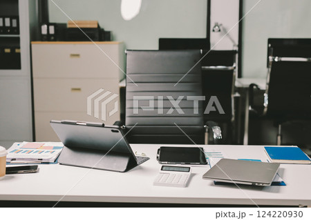 Cropped image of professional businesswoman working at her office via laptop, young female manager using portable computer device while sitting at modern loft, flare light, work process concept Cropped image of professional businesswoman working at her office via laptop, young female manager using portable computer device while sitting at modern loft, flare light, work process concept 124220930