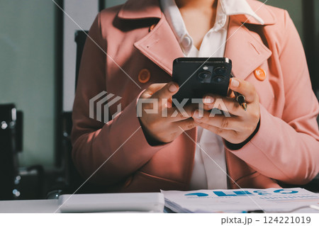 Cropped image of professional businesswoman working at her office via laptop, young female manager using portable computer device while sitting at modern loft, flare light, work process concept Cropped image of professional businesswoman working at her office via laptop, young female manager using portable computer device while sitting at modern loft, flare light, work process concept 124221019