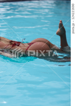Enjoying the Art of Graceful Swimming in the Crystal Clear Pool Water during Summer Days Enjoying the Art of Graceful Swimming in the Crystal Clear Pool Water during Summer Days 124221690