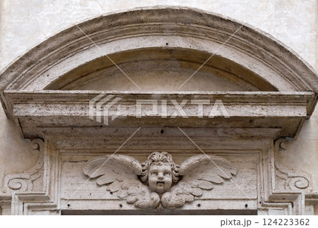 Angel on the portal of San Giovanni della Pigna Church in Rome, Italy 124223362