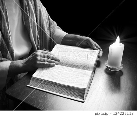 Man reading an old bible Man reading an old bible 124225118