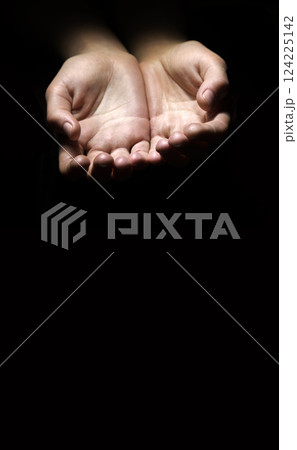 Asking hands on black backdrop Asking hands on black backdrop 124225142
