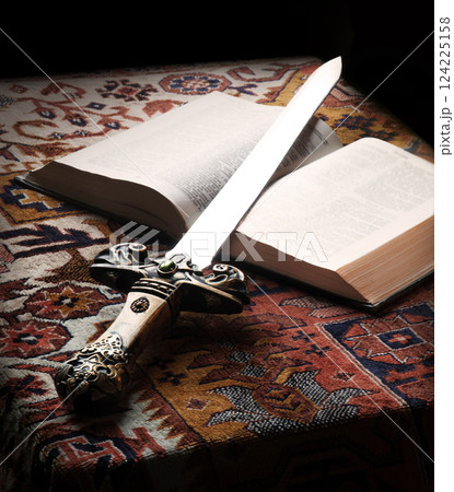 Old sword on the bible 124225158