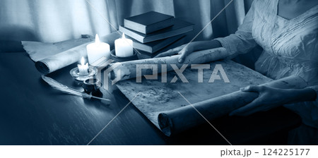 Hands with an old scroll Hands with an old scroll 124225177