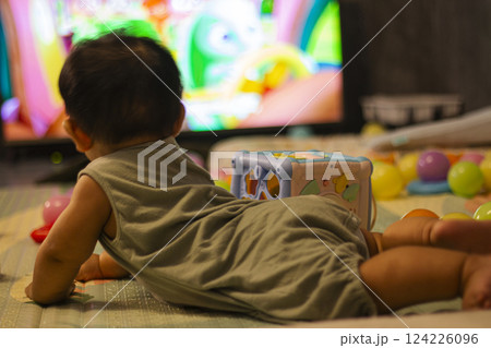 Baby In Bodysuit Is Crawling On A Soft Mat Baby In Bodysuit Is Crawling On A Soft Mat 124226096