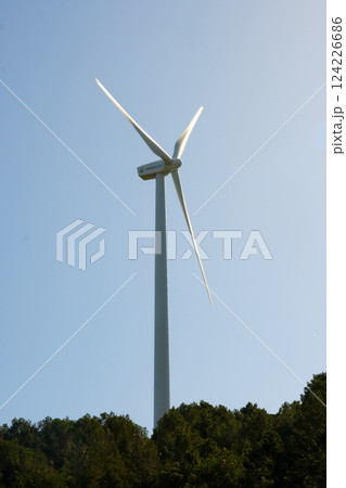 Wind turbine with blue sky at background Wind turbine with blue sky at background 124226686