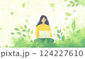 Woman in green nature-inspired setting working on laptop, meditative focus 124227610