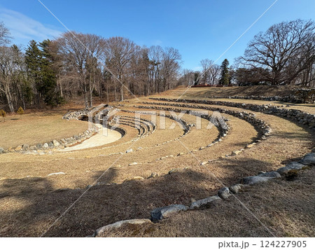 Ancient Stone Amphitheater Surrounded by Winter Trees in Sunlight 124227905