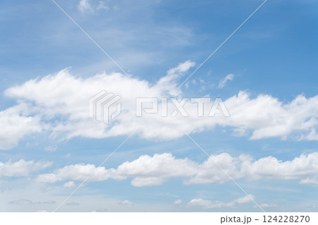 Clear blue color sky with white cloud background 124228270
