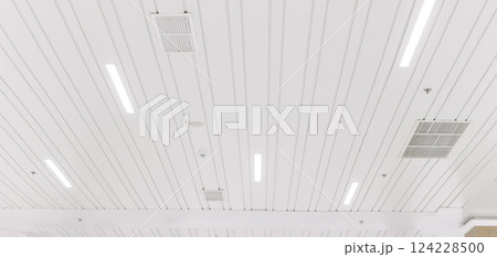 Ceiling mounted cassette type air conditioner and modern lamp light on a white ceiling. duct air conditioner for office or home Ceiling mounted cassette type air conditioner and modern lamp light on a white ceiling. duct air conditioner for office or home 124228500