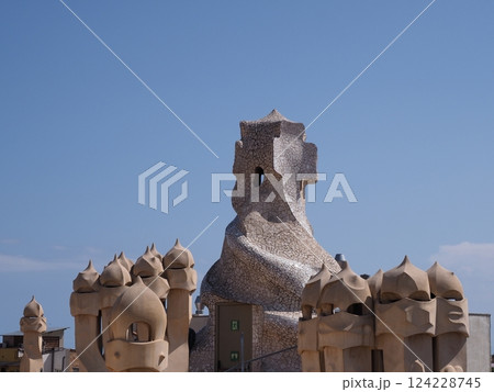 Beauty chimneys on rooftop in European city of Barcelona in Spain Beauty chimneys on rooftop in European city of Barcelona in Spain 124228745